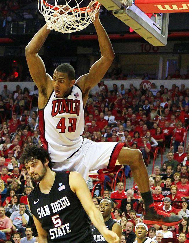 UNLV forward Mike Moser dunks on San Diego State forward Garrett Green during their Mountain West Conference game Saturday, Feb. 11, 2012 at the Thomas & Mack Center. UNLV won the game 65-63.